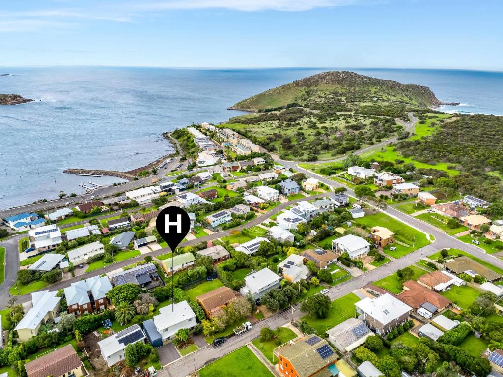 an aerial view of a village next to the ocean at Encounter Bay Family Escape, Sea Views, Games Room & Walk to The Bluff in Encounter Bay