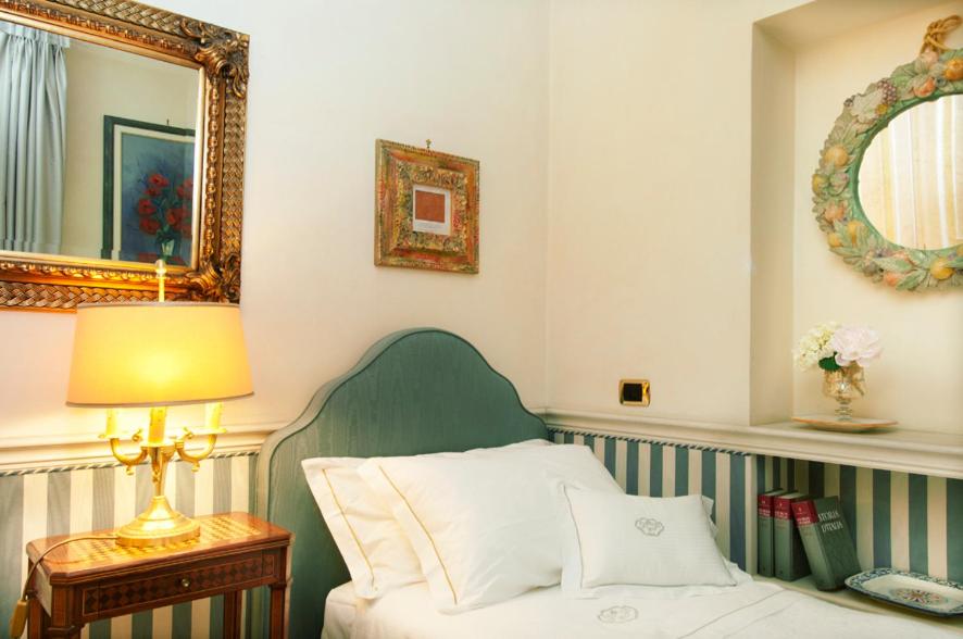 Postel nebo postele na pokoji v ubytování Petit Palais Hotel De Charme