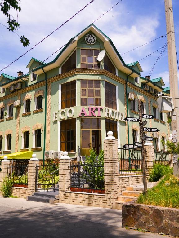 a building with a sign that reads go apeliction at ECO ART Hotel in Tashkent