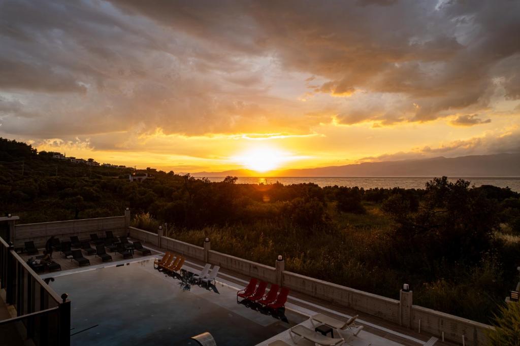a view of the sunset from the balcony of a resort at Asil Luxury Boutique in Burhaniye