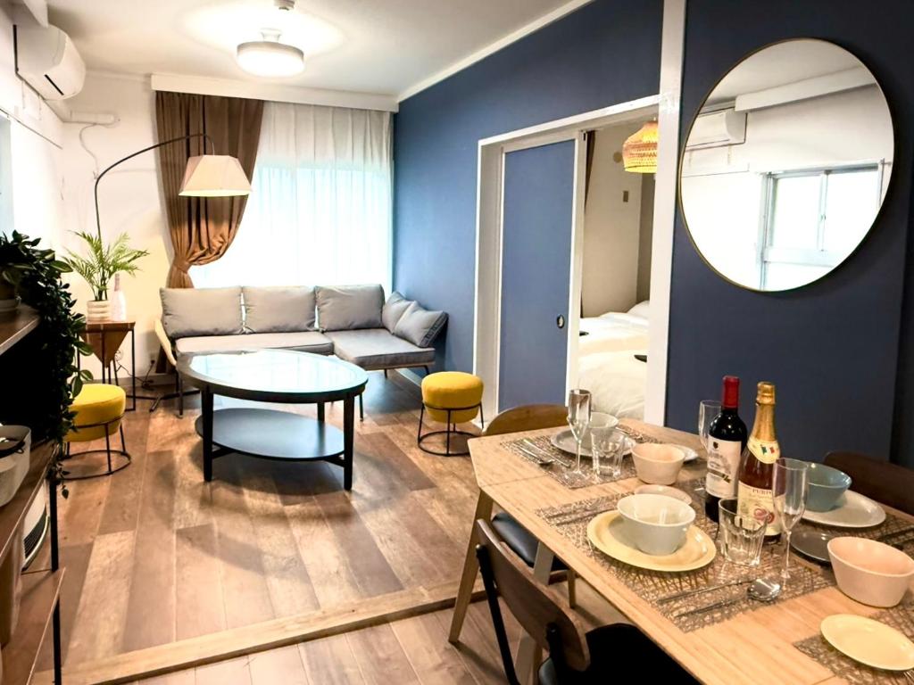 a living room with a table and a couch at Sunlife in Sendai