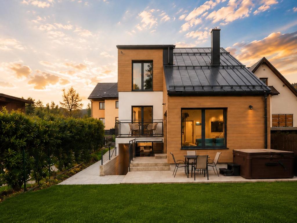 a house with a black roof at Villa ZENORIA in Zuberec