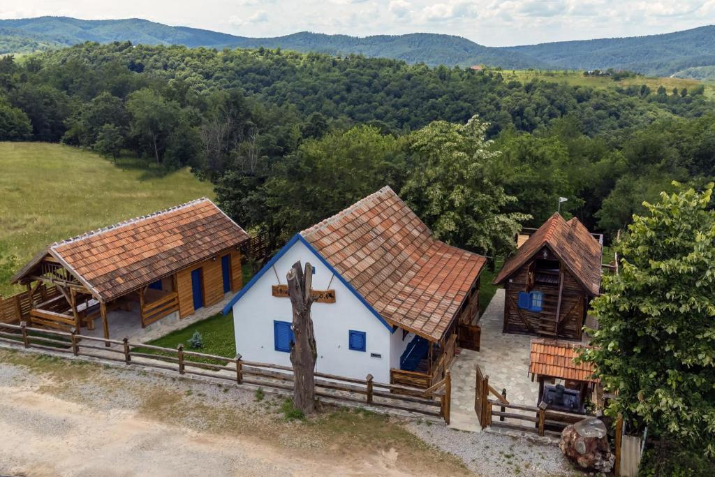 an aerial view of a church with a cross at CASA HAIDUCILOR Green Codru in Codru