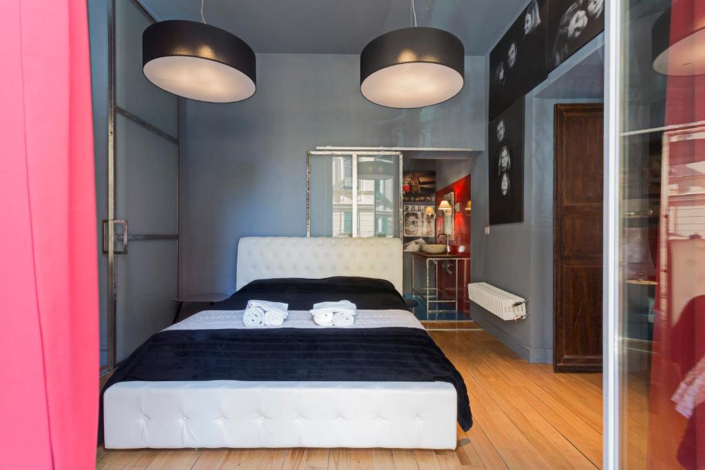 Postel nebo postele na pokoji v ubytování Loft Garibaldi