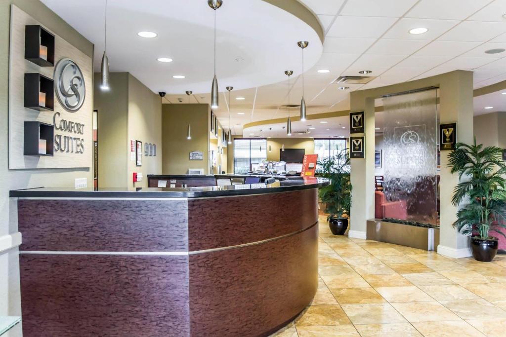 a lobby with a brown counter in a store at Comfort Suites Palm Bay - Melbourne in Palm Bay