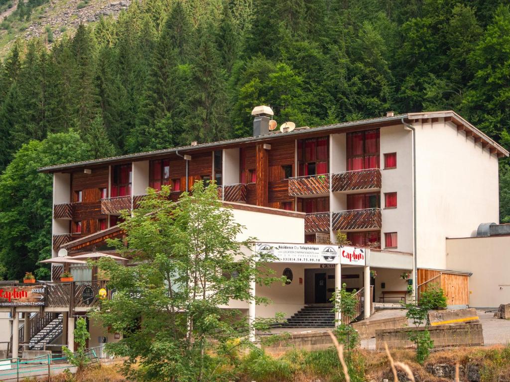 a hotel in the mountains with trees at Résidence Capfun du Téléphérique, Morzine in Morzine