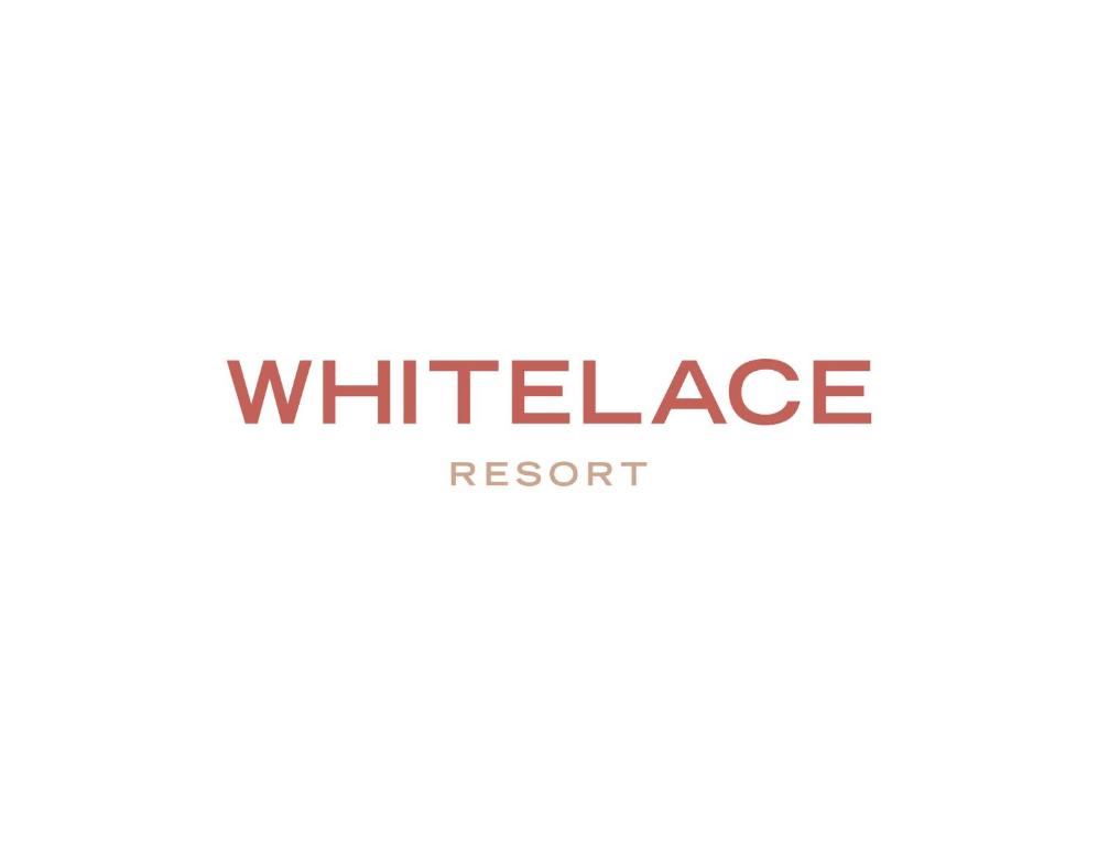 a picture of the white intelligence resort logo at WhiteLace Resort in Jbeil