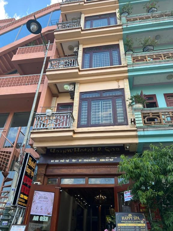 a building with balconies on the side of it at Happy Hotel & Spa in Sapa