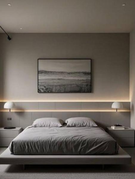 a bedroom with a bed with a picture on the wall at Alfathpark in Nyomolong