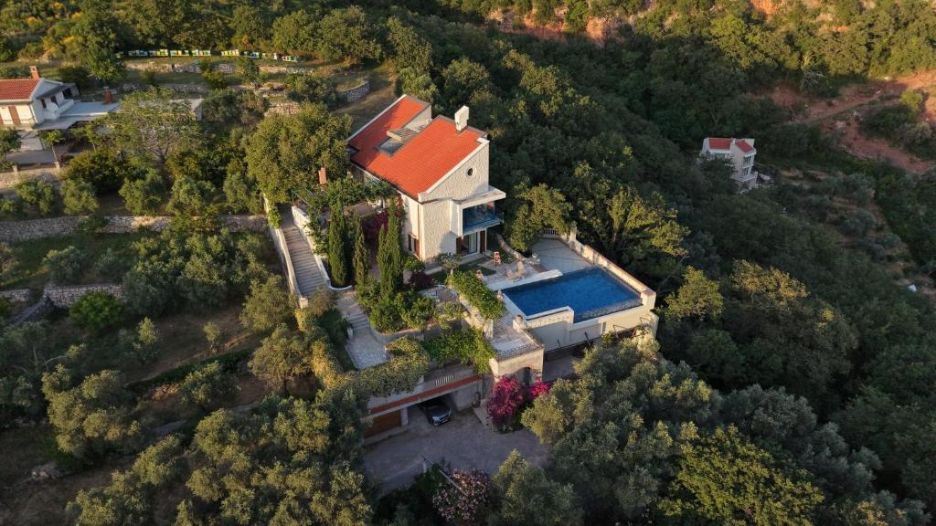 an overhead view of a large house with a red roof at Villa Verra in Pržno