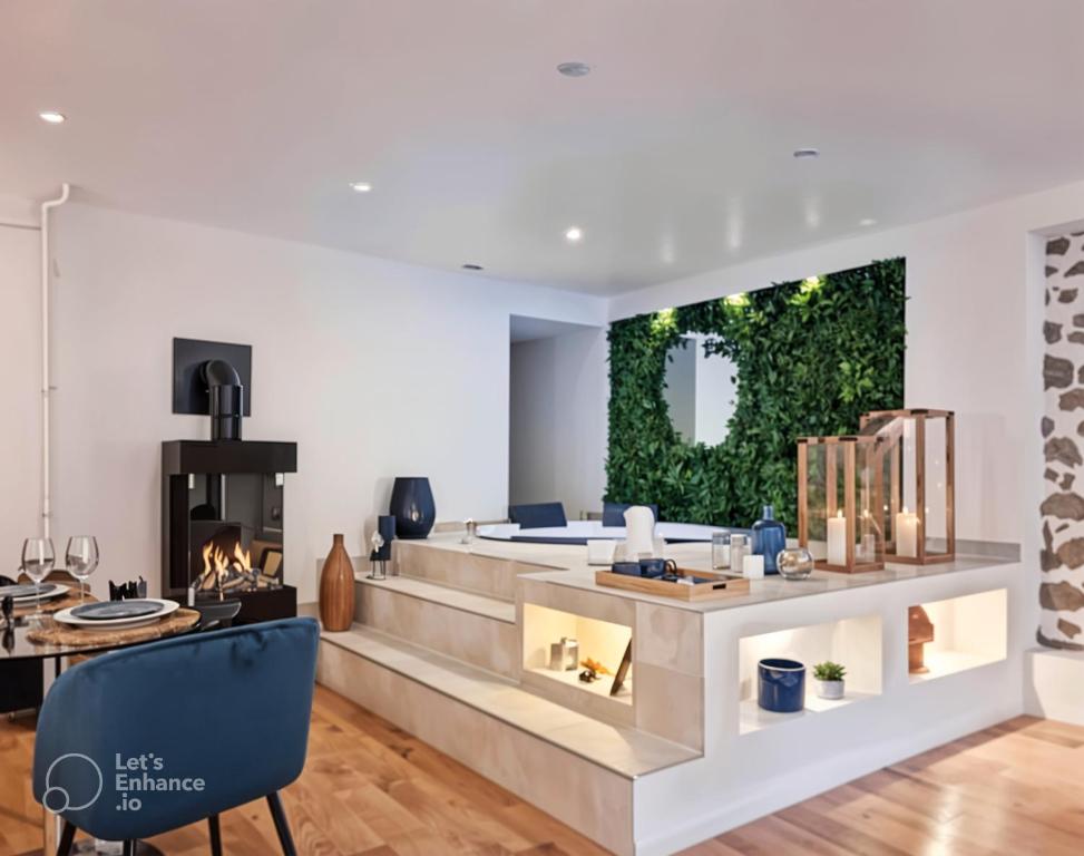 a living room with a fireplace and a couch at Suites avec Jacuzzi Privé & Terrasse - Vieille Ville d'Annecy in Annecy
