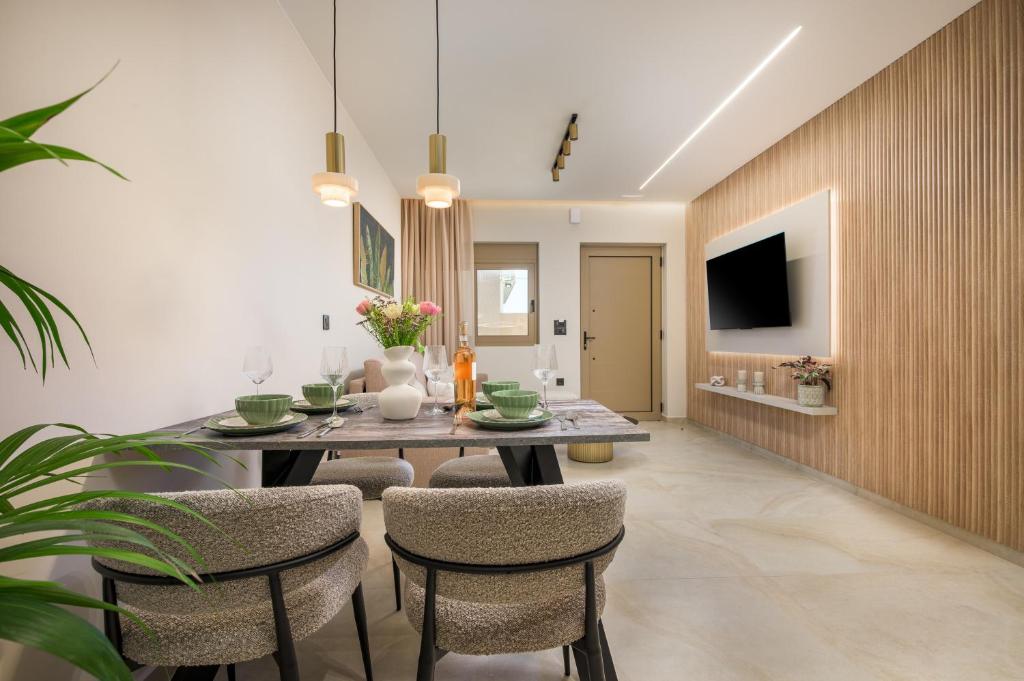 a dining room with a table and chairs at MSBeach Luxury Homes - Manolis in Kos