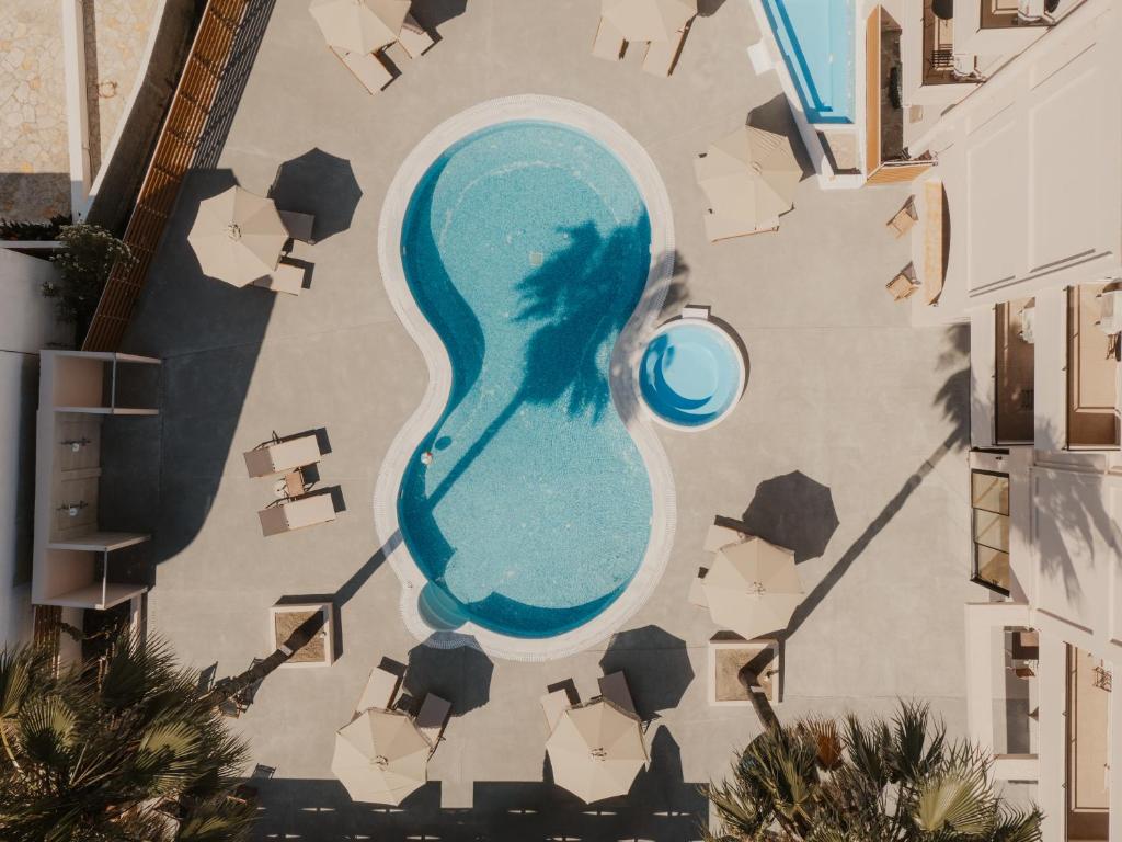 an aerial view of a swimming pool in a resort at Cavo Notos Beach Hotel in Kavos