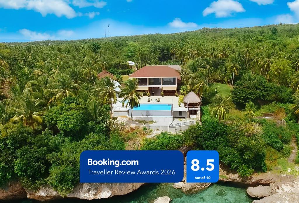 an aerial view of a villa on a tropical island at RedDoorz at Homa Resort Hotel in Camotes Islands