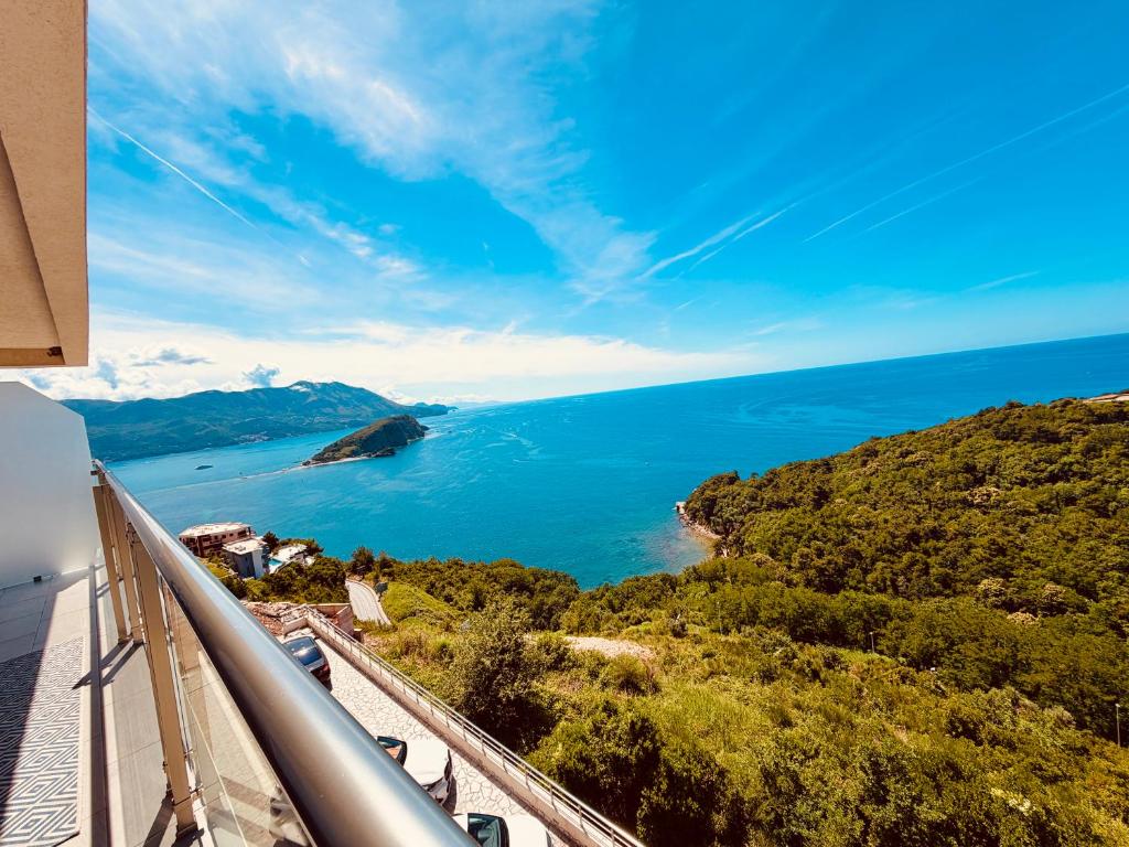 a view of the ocean from the balcony of a house at Tophill Altezza stunning sea view & Terrace in Budva