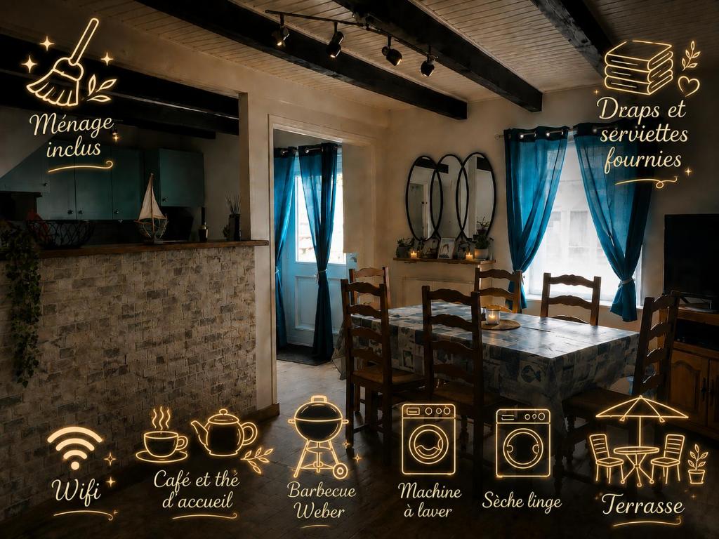 a dining room with a table and chairs and lights at Maison en pierre pour 6-jardin &animaux bienvenus in Languidic