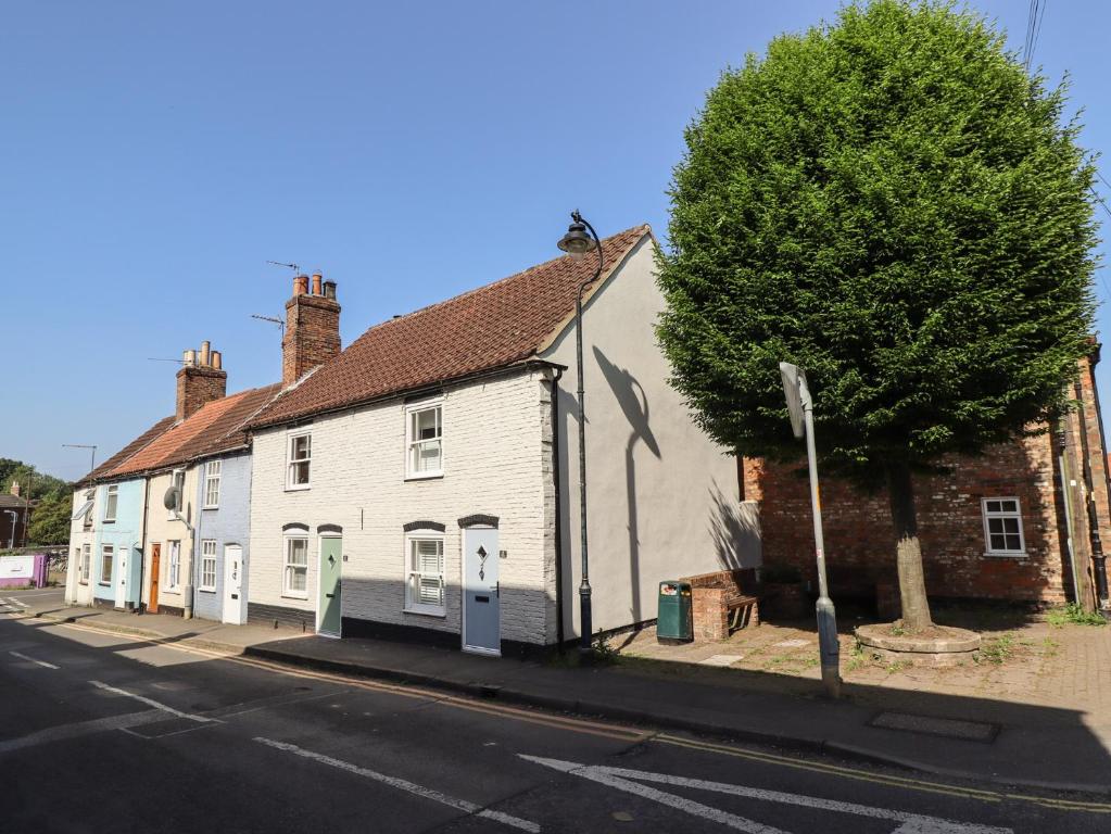 a row of white houses on a street at 4 Eve Street in Louth