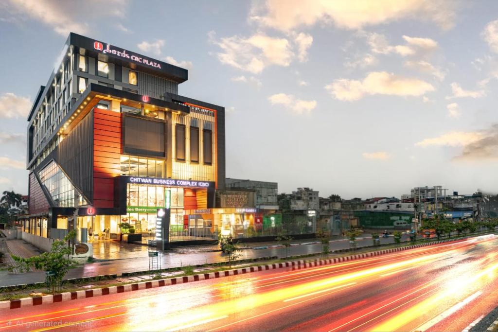 a building on the side of a street with a road at Lords CBC Plaza Chitwan in Bharatpur
