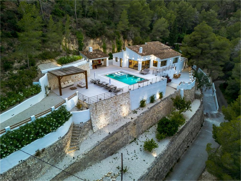 an aerial view of a house with a swimming pool at Caray - Managed by Almarina Villas in Benissa