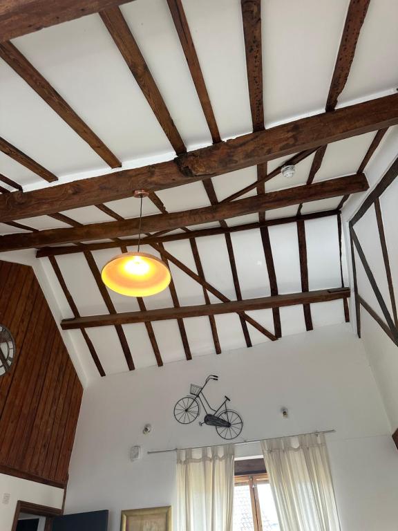 a bike on the ceiling of a room at The Upper Nest in Hereford