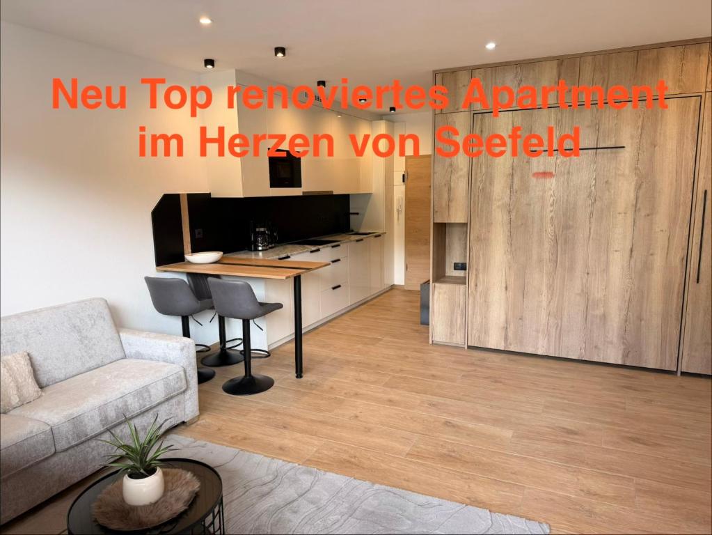 a living room with a couch and a table at Excelsior Top 17 Alpenherz in Seefeld in Tirol