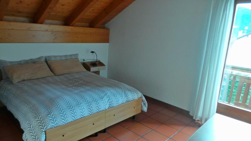Postel nebo postele na pokoji v ubytování Appartamenti Al Ploz
