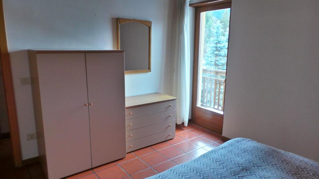 Postel nebo postele na pokoji v ubytování Appartamenti Al Ploz