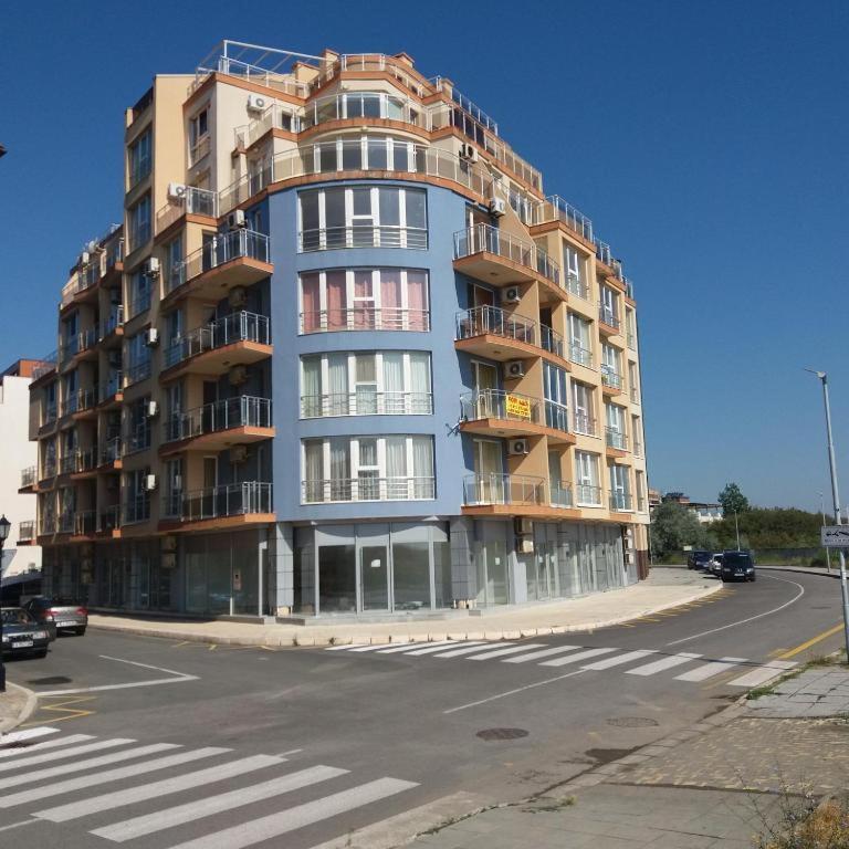 a large apartment building on the corner of a street at goldenseaview apartment 2 in Pomorie