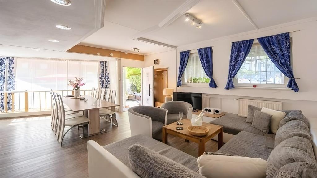 a living room with a couch and a table at Ferienwohnung Vulkaneifel in Daun