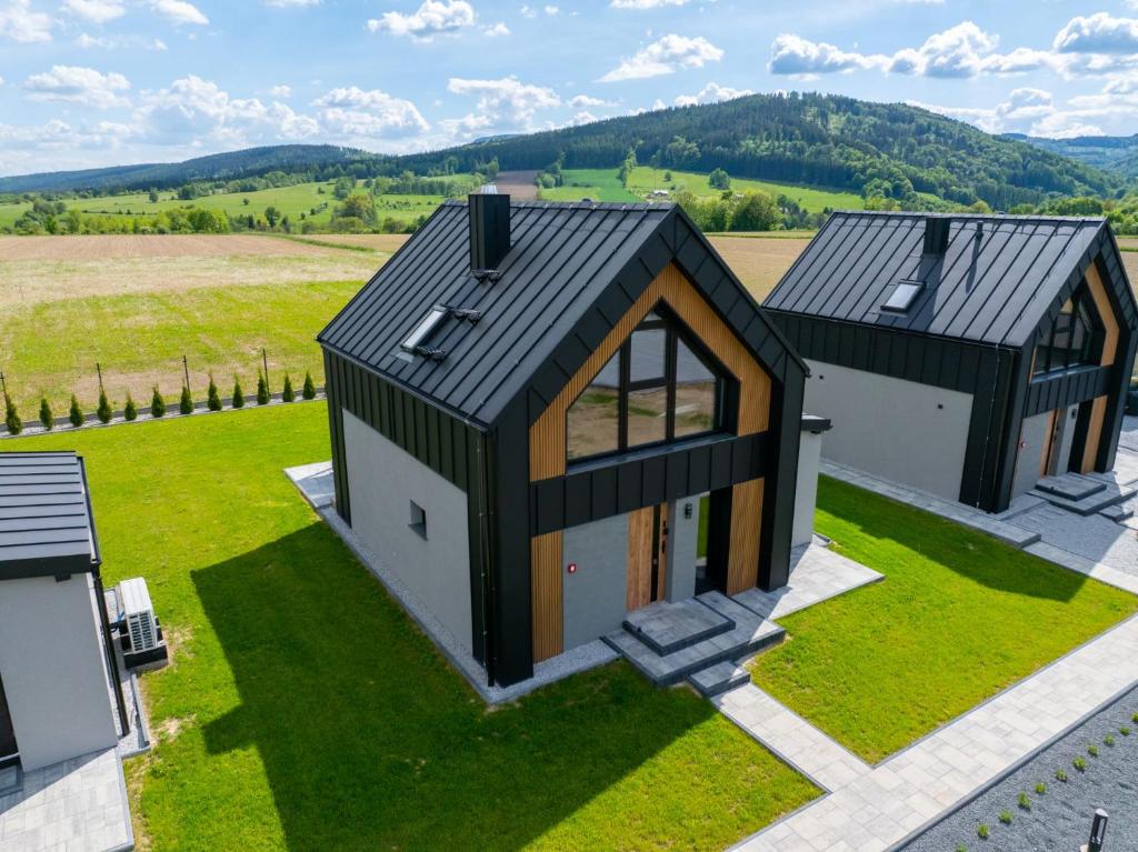 an overhead view of a house with a black roof at Panorama Sudety in Nowa Bystrzyca