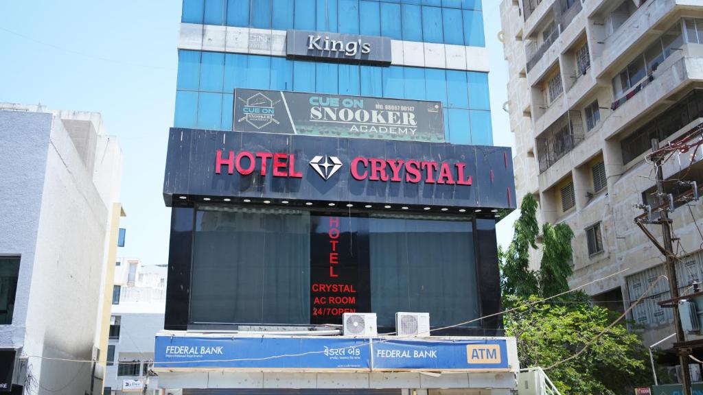 a view of a hotel superstar sign in a city at Hotel Crystal Rajkot in Rajkot