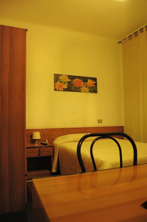 Postel nebo postele na pokoji v ubytování Hotel Major