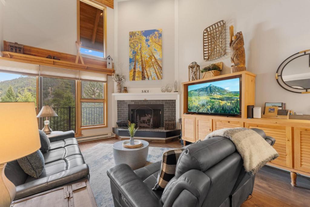 a living room with a couch and a television at Pines #2041 : 2 in Keystone