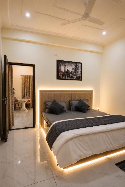 a bedroom with two beds and a mirror at Sukoon stays Bhimtal 3 bed in Bhīm Tāl