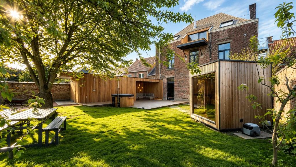 a backyard with a wooden fence and a house at Le Clos Boréal - Gîte Spa Privatif in Lens