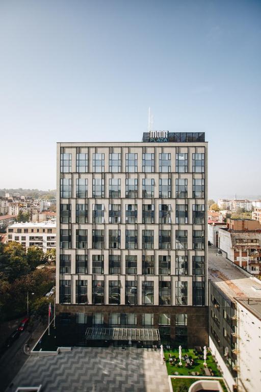 a large building with a lot of windows at Hotel Mona Plaza in Belgrade