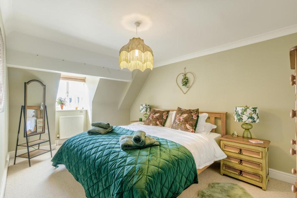 a bedroom with a bed with towels on it at 2 Bed in Blythburgh oc-w42765 in Blyford
