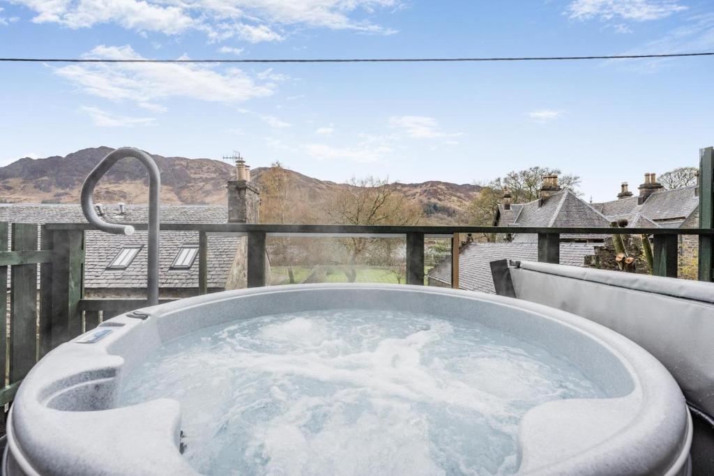 a jacuzzi tub on the deck of a house at 2 Bed in St. Fillans oc-a40242 in Saint Fillans