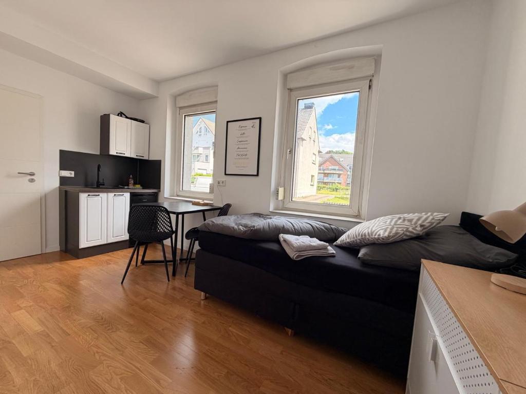 a living room with a couch and a table at GWP Apartments in Lohmar