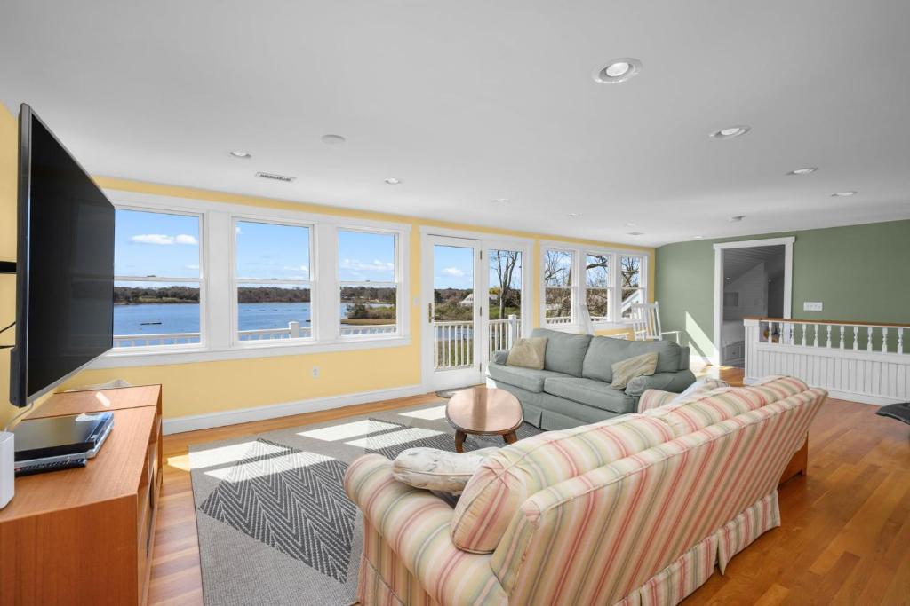 a living room with a couch and a flat screen tv at Kelley Lane - CHT- KL161 in Chatham