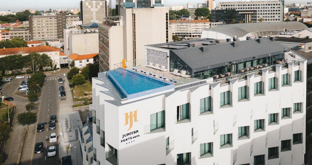 an aerial view of a building in a city at Jupiter Porto Hotel - Rooftop & Spa in Porto