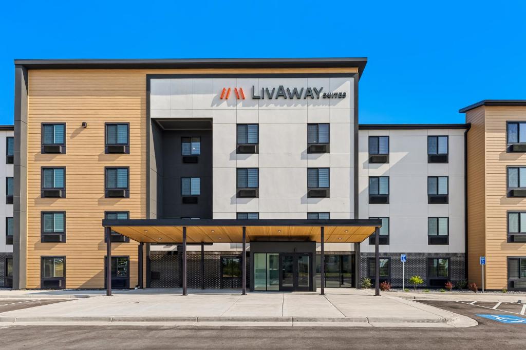 an image of an ivy hotel with a building at LivAway Suites Phoenix-Surprise in Surprise