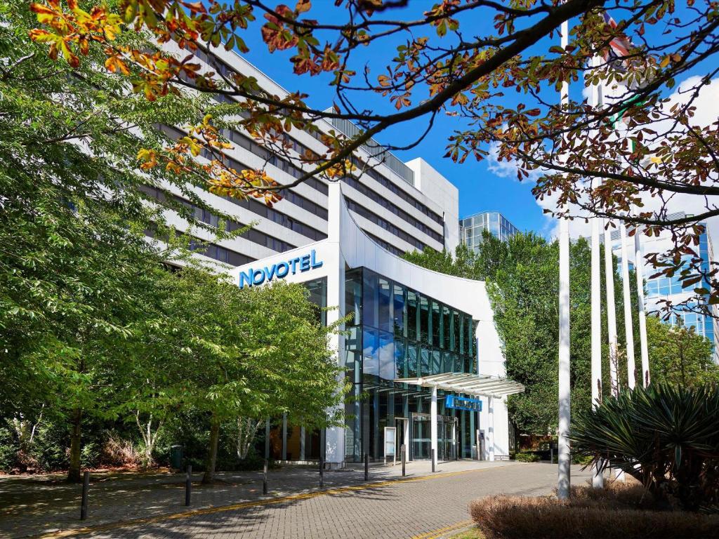 a building with a sign on the front of it at Novotel London West in London