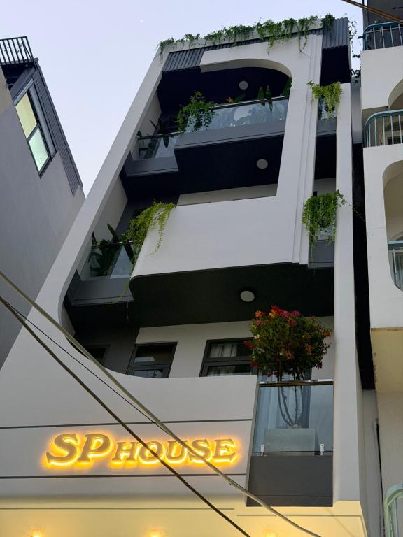 a building with a sign that reads sprecage at SP house in Ho Chi Minh City