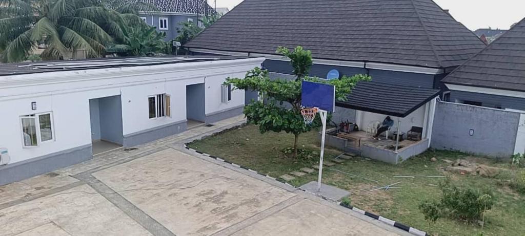 an overhead view of a house with a basketball hoop at House One Apartment in Akure