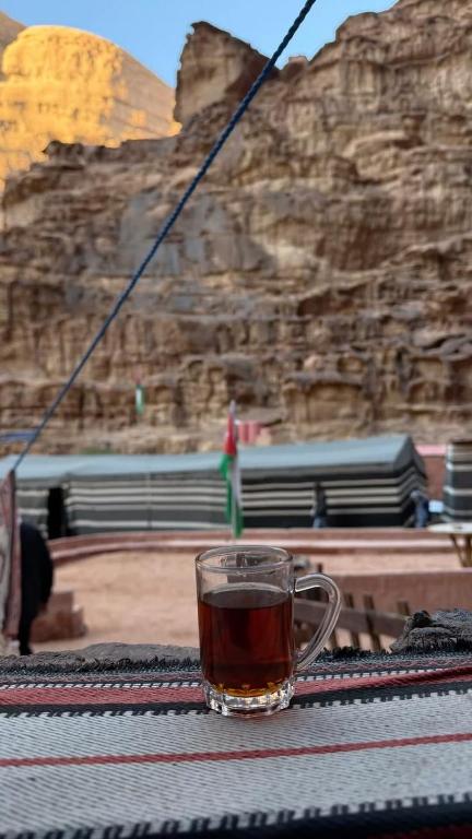 a cup of tea sitting on top of a table at وادي رم in Disah