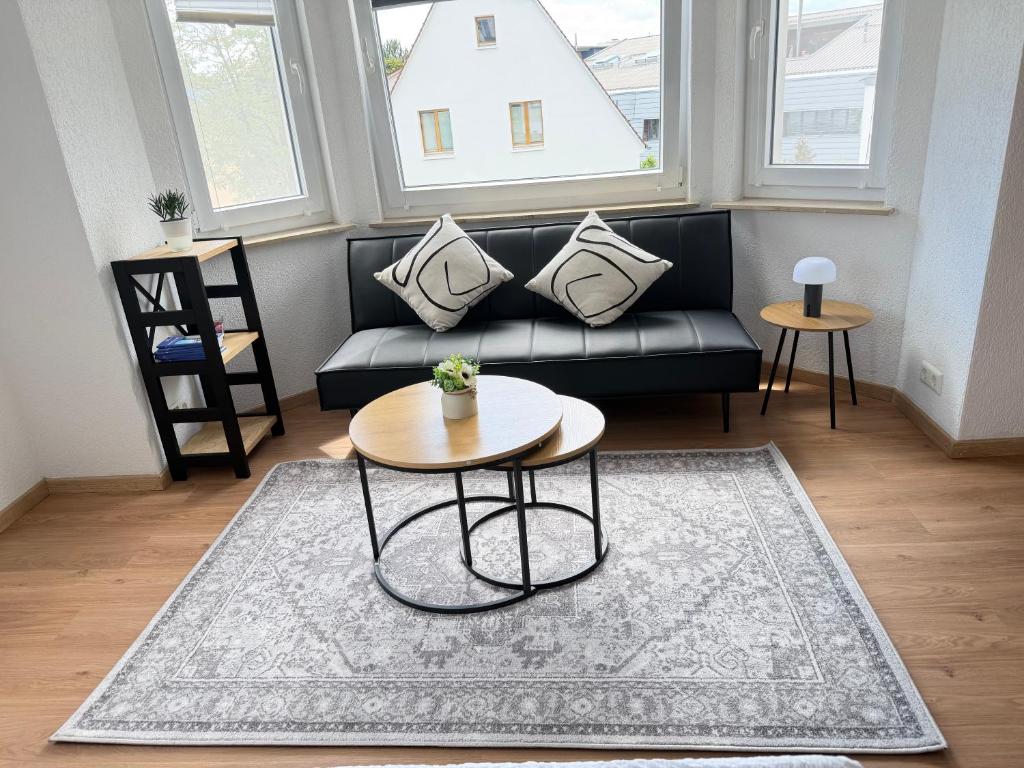 a living room with a couch and a table at Ferienwohnung Trinh in Überlingen