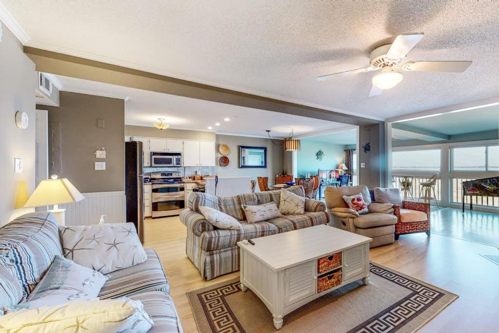 a living room with a couch and a table at Our Place At The Beach 206B in Ocean City