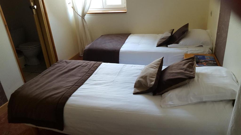 Postel nebo postele na pokoji v ubytování Hotel Ô Fil de L'ô