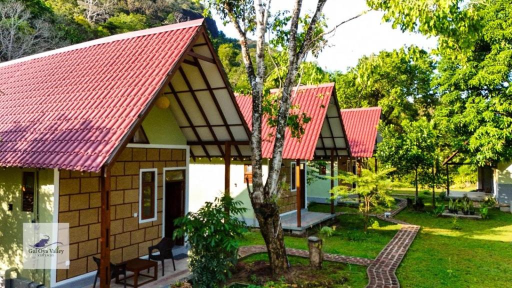 a house with a red roof at Gal Oya Valley Cottages in Ampara